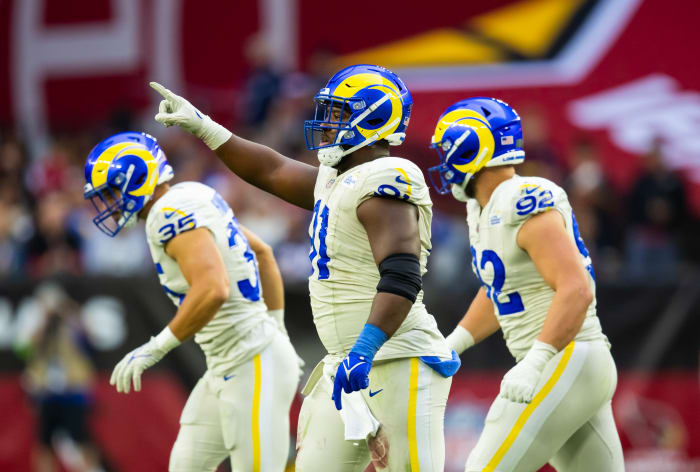 Nov 26, 2023; Glendale, Arizona, USA; Los Angeles Rams defensive tackle Kobie Turner (91) celebrates a play against the Arizona Cardinals at State Farm Stadium.